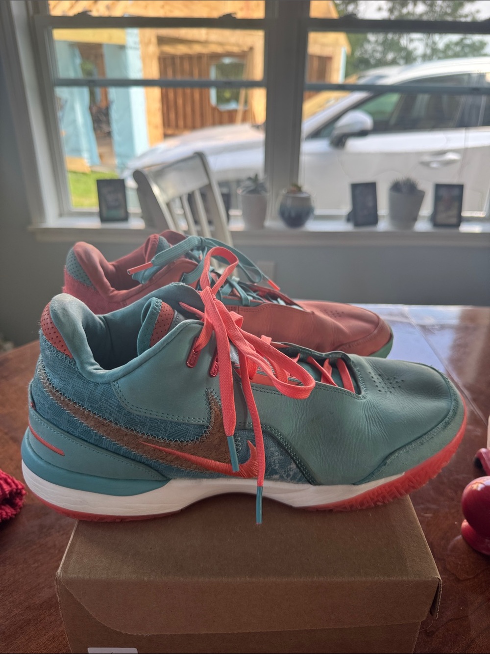The Nike LeBron NXXT Gen AMPD "Mineral Blue/Light Wild Mango" Basketball Shoes